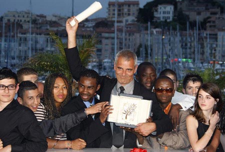 French director Laurent Cantet (C) is surrounded by students