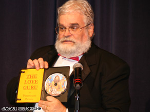 Razzie founder John Wilson holds the DVD of "Love Guru" shortly before shredding it.