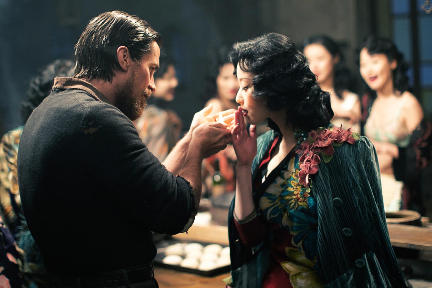 Christian Bale as John Miller and Ni Ni as Yu Mo in THE FLOWERS OF WAR