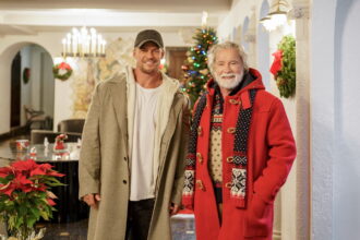 The Man With the Bag Alan Ritchson and Arnold Schwarzenegger