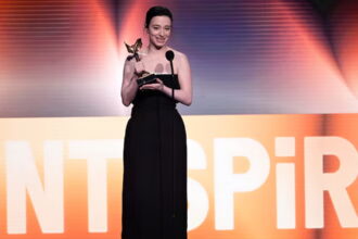 Mikey Madison accepts the award for best lead performance for "Anora" during the Film Independent Spirit Awards on Saturday, Feb. 22, 2025