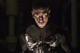 Bernthal’s Punisher silhouetted in a dark alley
