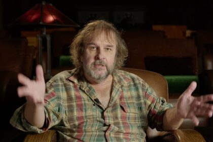 Peter Jackson in a chair